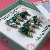 Press-on nails with a glittery, bling design from Cutie Pop Nail Shop&