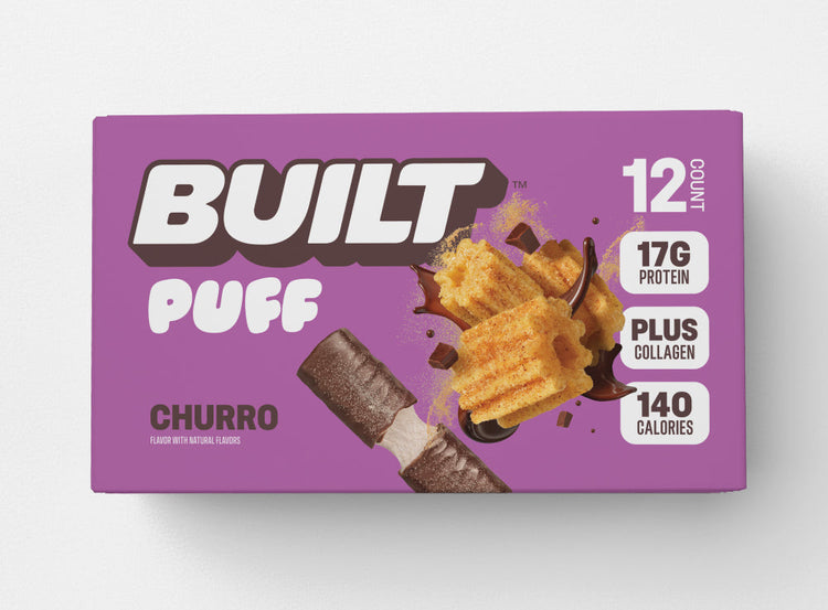 BUILT Churro Puff snack with crispy churro-flavored exterior and creamy filling, displayed on a neutral background.