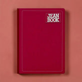 Set of colorful Jean Book notebooks from Farmacias Savia with vibrant covers and various sizes for note-taking and journaling.