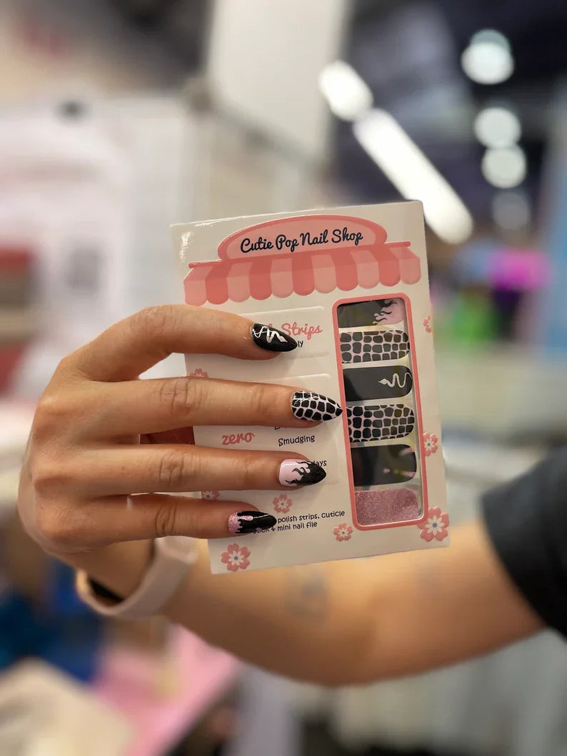 Pink Venom nail strips by Cutie Pop Nail Shop, stylish pink and black nail art design on glossy strips.