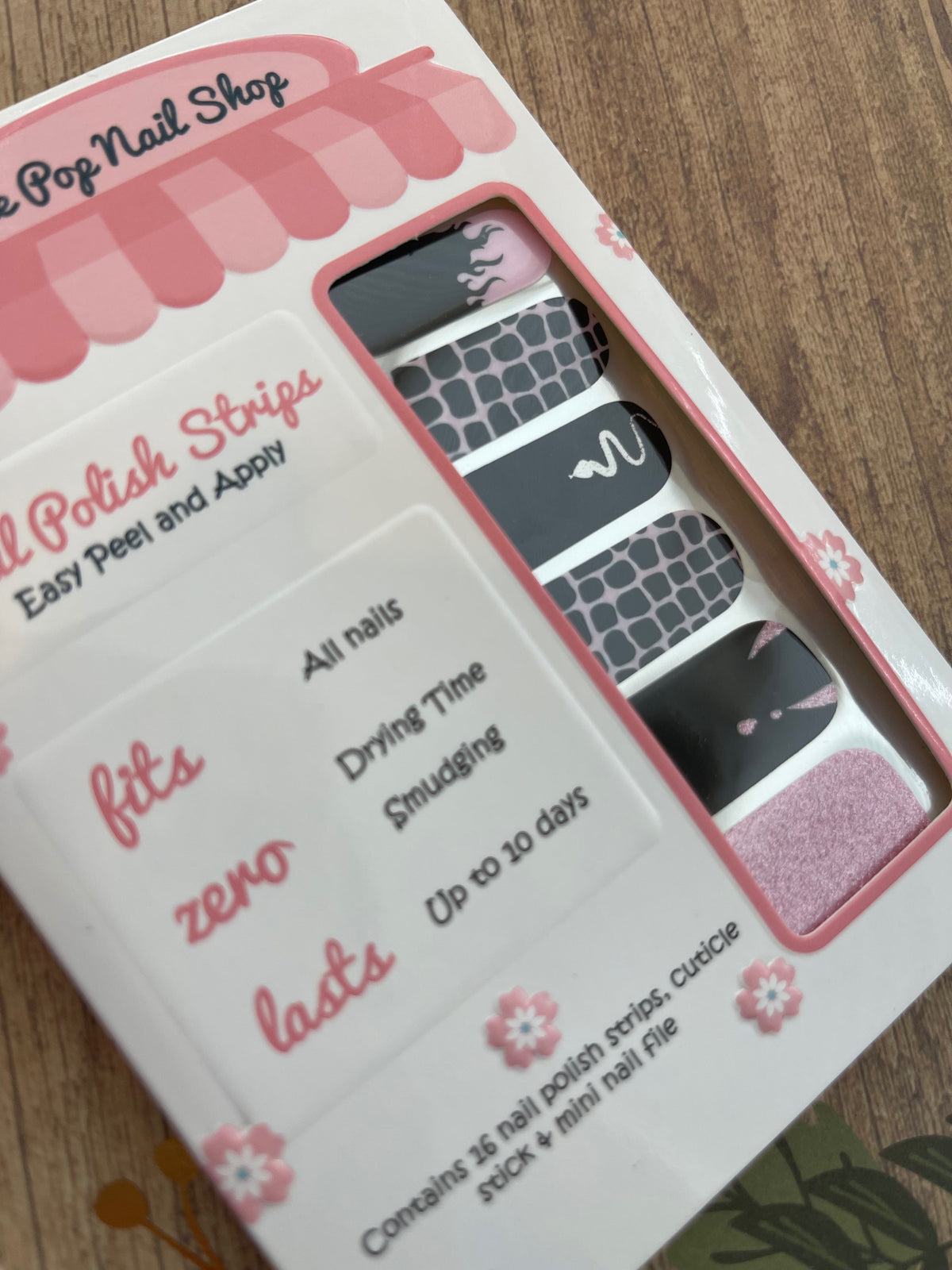 Pink Venom nail strips by Cutie Pop Nail Shop, featuring vibrant pink and black design for stylish manicures.