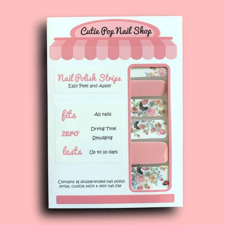 Fairytale nail strips by Cutie Pop Nail Shop, featuring whimsical fairy tale-inspired designs on adhesive nail strips.