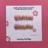 Glittery blush pink press-on nails from Cutie Pop Nail Shop with a sparkling finish and elegant design.