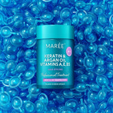Maree keratin oil capsules for frizz control, showing glossy hair with smooth, frizz-free appearance in a close-up shot.