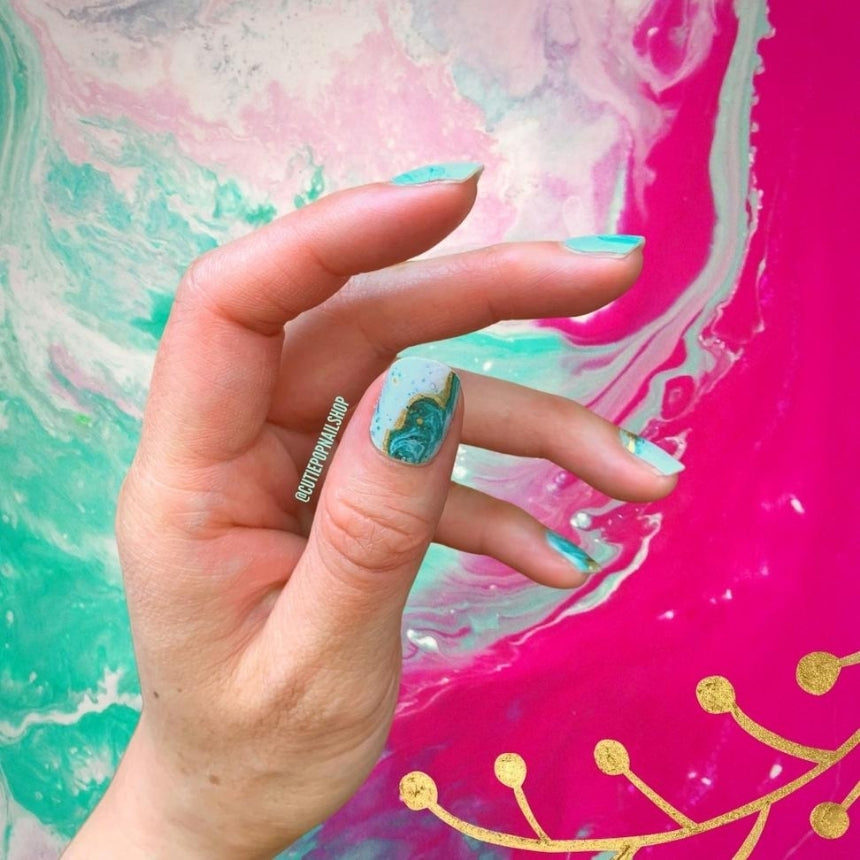 Gold Justice nail strips by Cutie Pop Nail Shop displayed on a neutral background.
