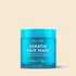 Maree keratin mask for damaged hair, deep conditioning treatment in a jar with a creamy texture and application spatula.