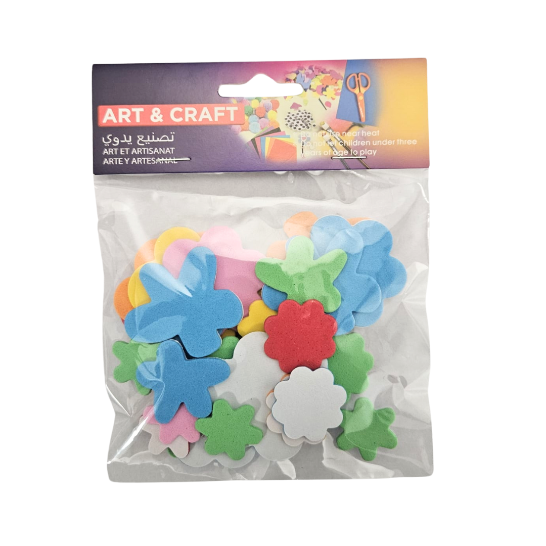 Assorted school craft supplies including colorful papers, scissors, and markers for arts and crafts projects.