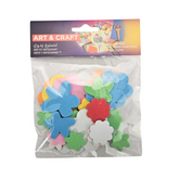 Assorted school craft supplies including colorful papers, scissors, and markers for arts and crafts projects.