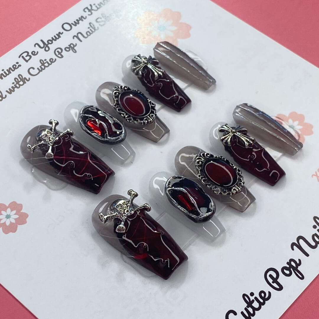 Rebel Chic press-on nails by Cutie Pop Nail Shop showcasing stylish, bold nail art on natural-looking nail tips.
