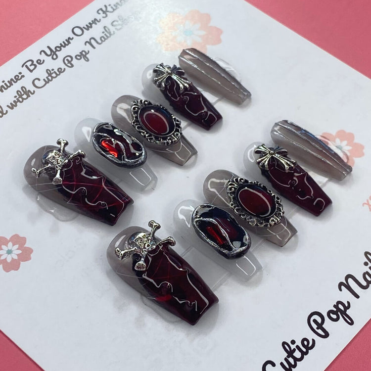 Rebel Chic press-on nails by Cutie Pop Nail Shop showcasing stylish, bold nail art on natural-looking nail tips.