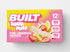 BUILT Pink Lemonade Sour Puff stack in a carton, showcasing the colorful, tangy sour candies with a pink lemonade flavor.