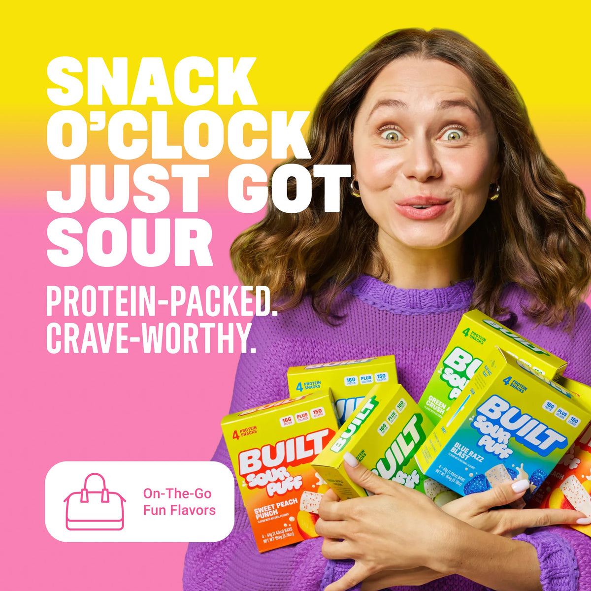 BUILT Pink Lemonade Sour Puff snack, stacked with vibrant pink color and textured surface, showcasing a tangy, sour candy treat.