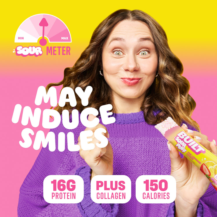 BUILT Pink Lemonade Sour Puff, colorful stacked sour candy puffs with pink lemonade flavor, vibrant and appealing.