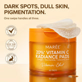 Maree Dark Spot Fading Vitamin C Pads with brightening serum and cotton pads for skincare in a clear container.