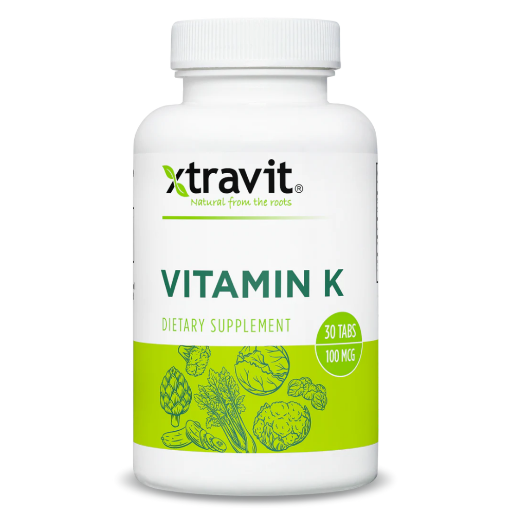 Xtravit Vitamin K capsules in a bottle, dietary supplement, 30-count, with label showing product name and branding.