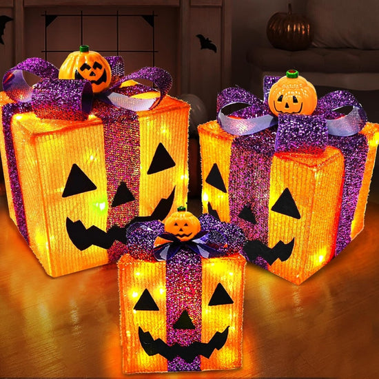 Set of three lighted Halloween pumpkin decorations with gift box and 60 LED lights, featuring carved pumpkin faces, by Outlets Yiume.