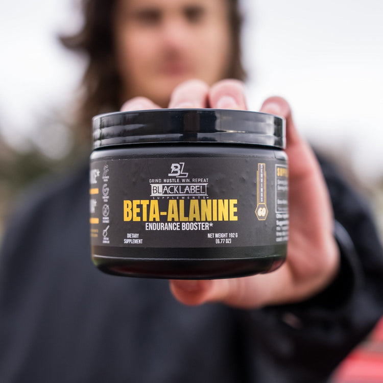BlackLabel Supplements Beta-Alanine powder in a container, showing the product label and supplement details.