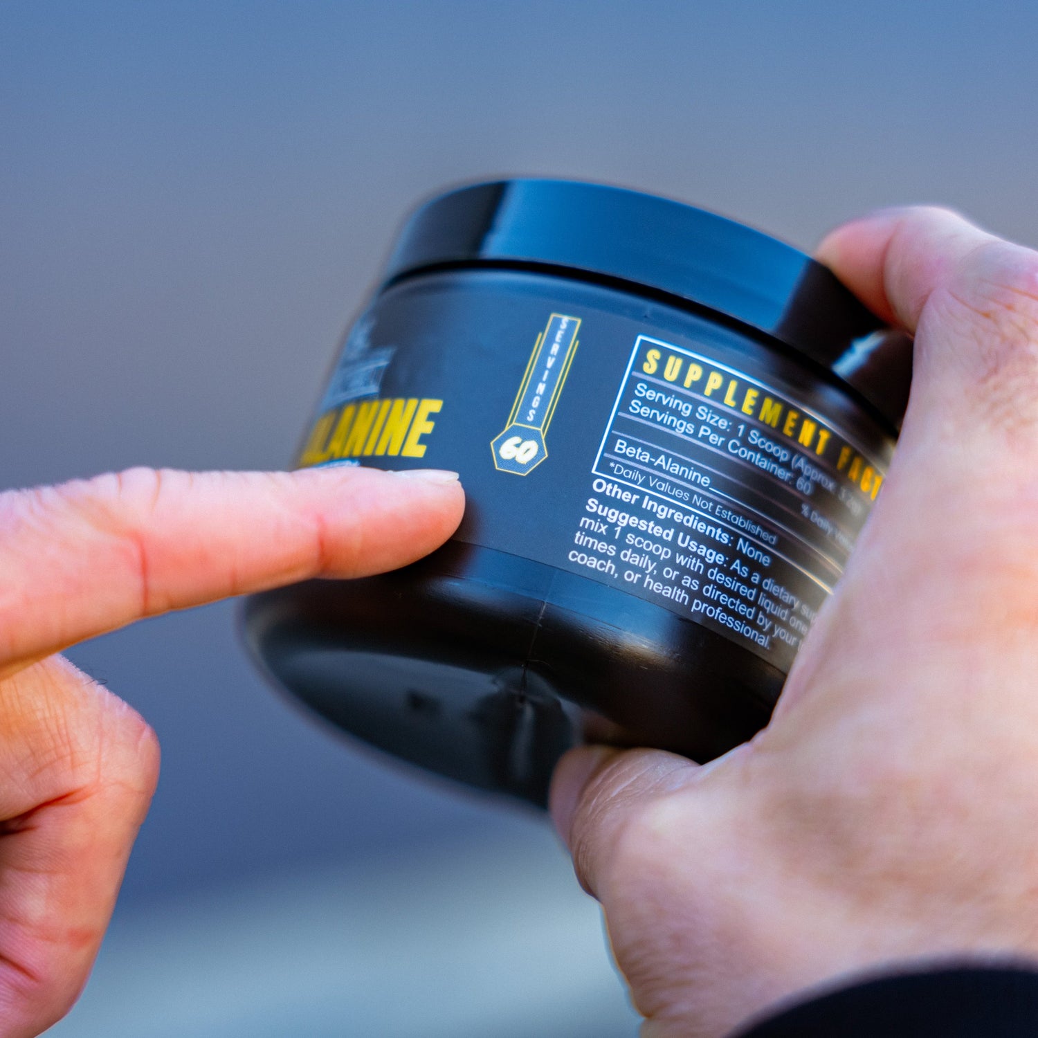 BlackLabel Supplements Beta-Alanine powder in a white container with a black lid, ready for workout supplementation.