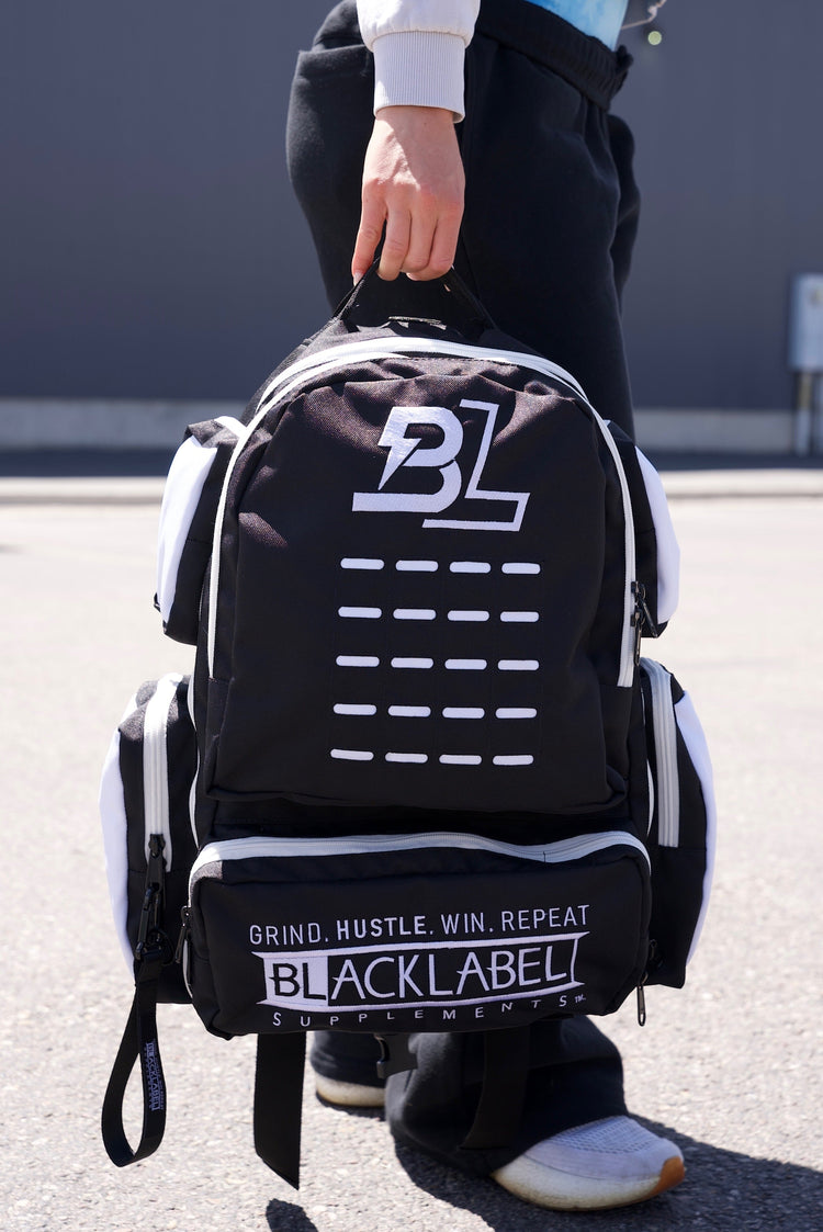 BlackLabel 26L backpack from BLACKLABEL Supplements, black nylon material with adjustable straps and multiple compartments.