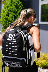 BlackLabel 26L backpack from BLACKLABEL Supplements, black with adjustable straps and multiple compartments.
