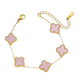 Pink clover enamel bracelet with gold accents, stylish jewelry piece featuring floral design and vibrant colors.