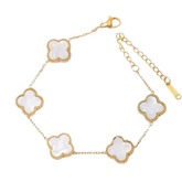 White mother of pearl Camila Clover bracelet with gold finish, elegant jewelry piece showcasing delicate floral design.