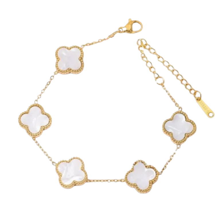 White mother of pearl Camila Clover bracelet with gold finish, elegant jewelry piece showcasing delicate floral design.
