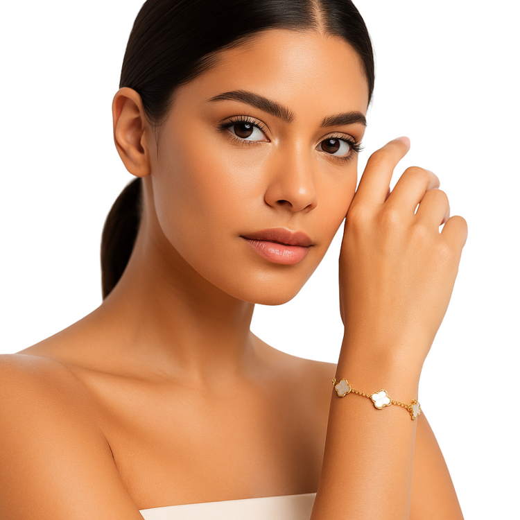 White mother of pearl Camila Clover bracelet with gold finish, elegant jewelry piece featuring a floral design.