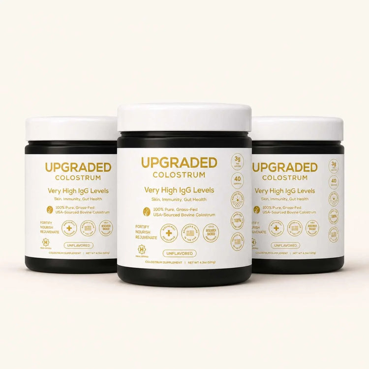 Upgraded Formulas® upgraded colostrum supplement in a jar, showing the product label and white powder inside.