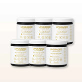 Upgraded Formulas® upgraded colostrum supplement bottle with label, showcasing the health and wellness product for immune support.