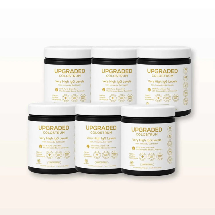 Upgraded Formulas® upgraded colostrum supplement bottle with label, showcasing the health and wellness product for immune support.