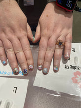Pastel Eevolution nail polish from Cutie Pop Nail Shop featuring soft pastel shades in a sleek bottle.