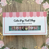 Press-on almond nails by Cutie Pop Nail Shop in Dark Lady, featuring a princess moon design with XS to medium size for a stylish look.