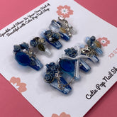 Medium coffin-shaped press-on nails with Bougie Bling 17 design by Cutie Pop Nail Shop, featuring shiny, decorative embellishments.