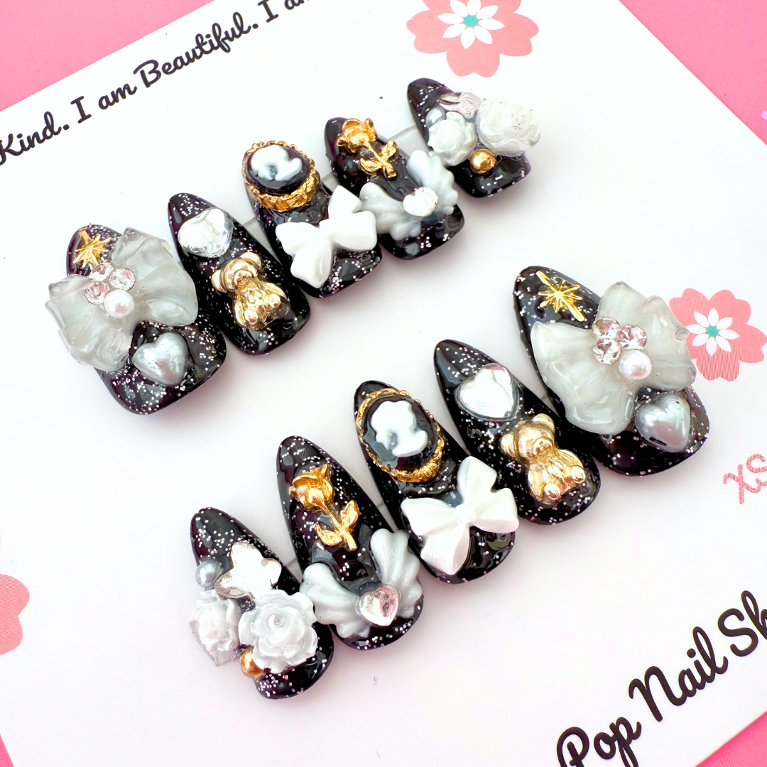 Medium coffin-shaped Victorian Shadows press-on nails by Cutie Pop Nail Shop with intricate dark floral designs.