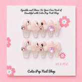 Short pink press-on nails with an elegant rose design from Cutie Pop Nail Shop, featuring a coffin shape and glossy finish.