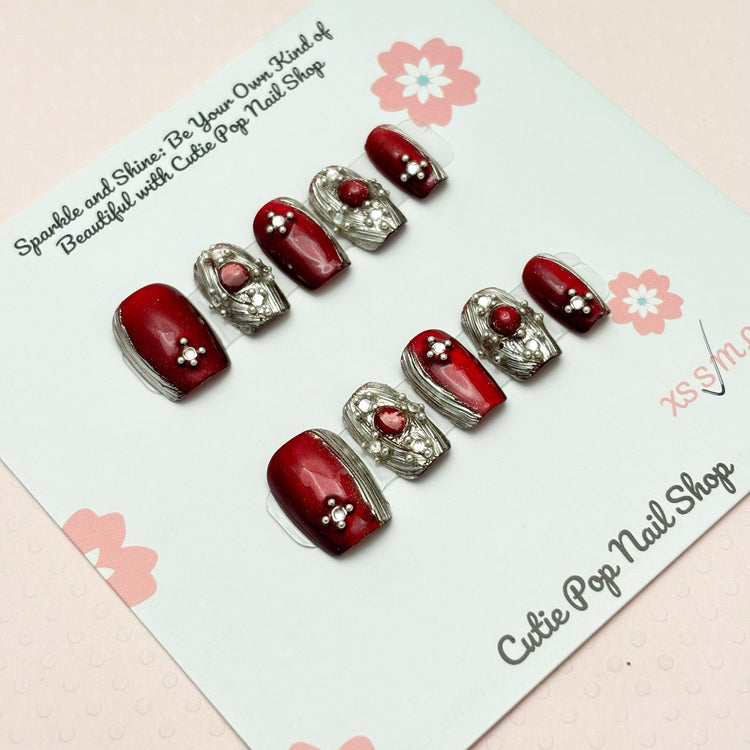 Red Renaissance press-on nails in coffin shape from Cutie Pop Nail Shop, extra short and stylish for a bold look.