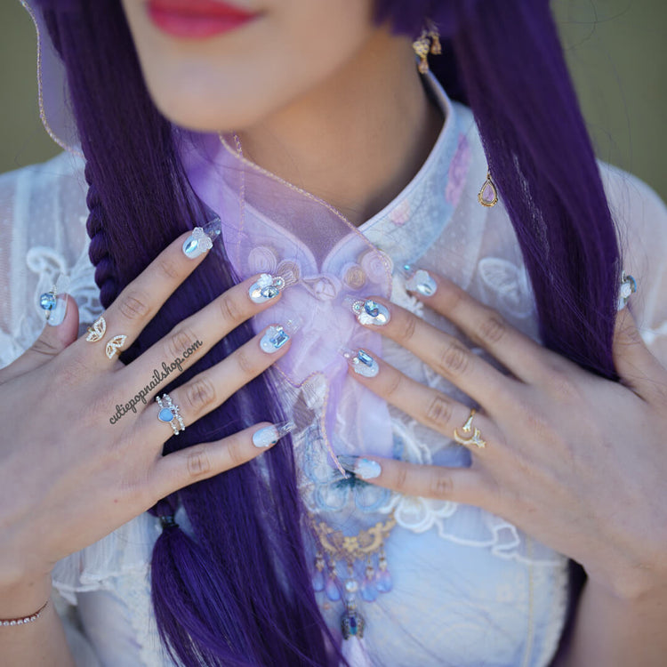 Blue Elegant Rose press-on nails by Cutie Pop Nail Shop in coffin shape, XS to medium size, showcasing detailed floral design.