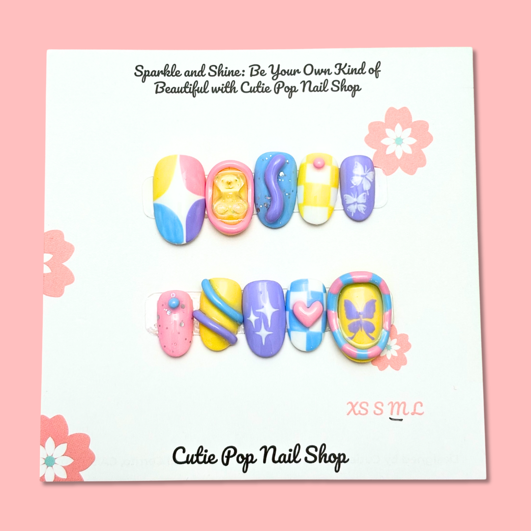 Short round press-on nails by Cutie Pop Nail Shop featuring twinkling butterfly designs for a stylish, easy-to-wear manicure.