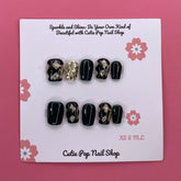 Short squoval press-on nails in a classy harlequinn design by Cutie Pop Nail Shop, showcasing elegant nail art and glossy finish.
