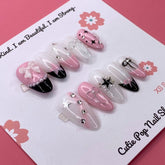 Press-on nails in Bloom Coquette style by Cutie Pop Nail Shop, featuring elegant, natural-looking nail tips with floral design.