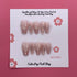 Champagne Pearls press-on nails from Cutie Pop Nail Shop featuring elegant pearl accents and a chic, glossy finish.