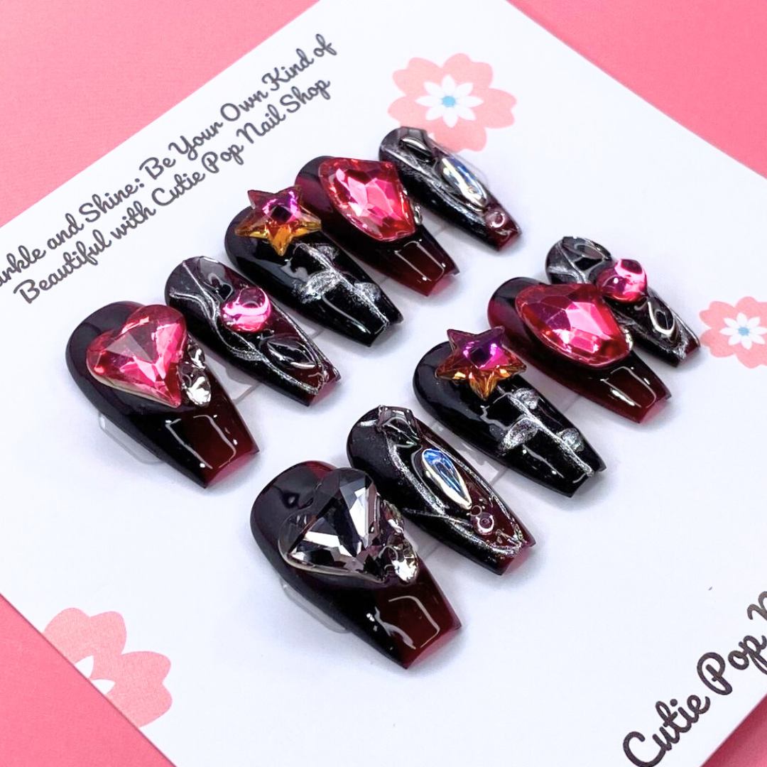 Gothic Ruby press-on nails by Cutie Pop Nail Shop featuring deep red and black gothic design on short nail tips.