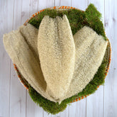 Ugandan Exfoliator Natural Loofah by Duma Mbili LLC, an African exfoliating scrubber for gentle skin exfoliation.