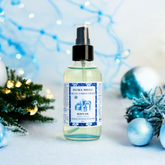 Blue Christmas Body Oil by Duma Mbili LLC, 4 oz, featuring a vibrant blue color and festive holiday-themed packaging.