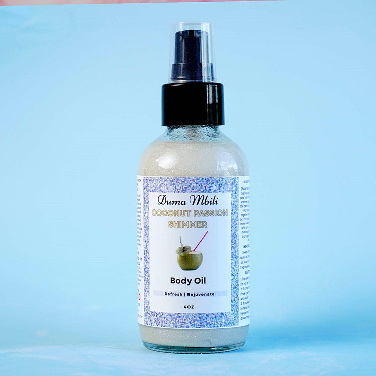 Duma Mbili LLC Coconut Passion Shimmer Body Oil in a 4 oz bottle, with a glossy label and transparent cap, showcasing a shimmering oil.