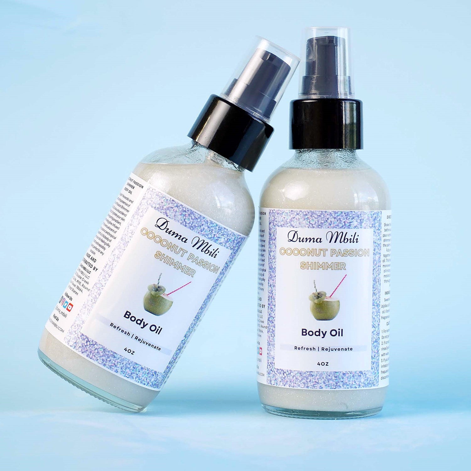 Duma Mbili LLC Coconut Passion Shimmer Body Oil in a 4 oz bottle with a glossy, shimmering finish and tropical coconut scent.