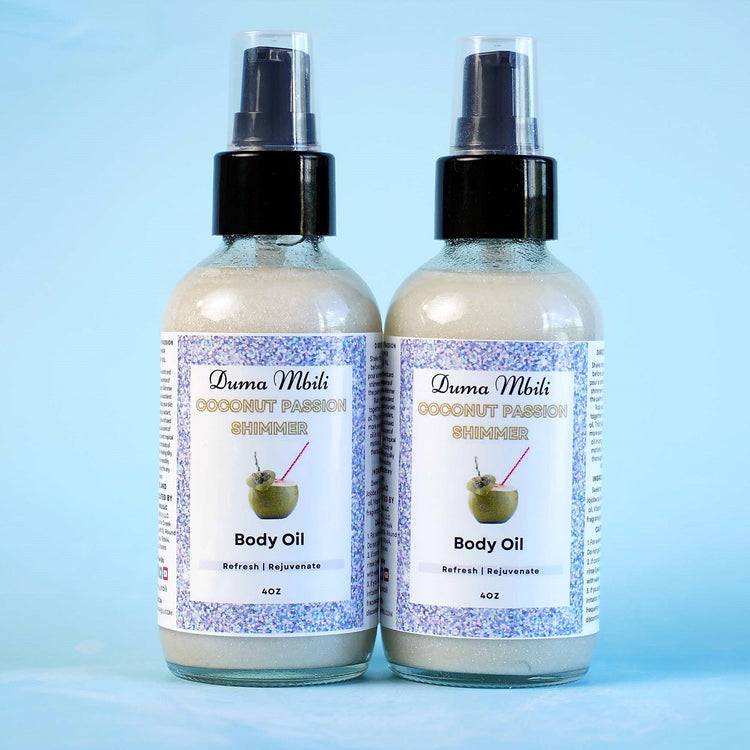 Coconut Passion Shimmer Body Oil by Duma Mbili LLC, 4 oz bottle with a shimmering, coconut-scented body oil and elegant packaging.