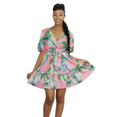 Floral V-neck summer mini dress by Duma Mbili LLC featuring a lightweight fabric and a stylish V neckline.