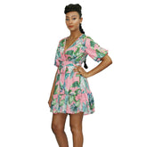 Floral V-neck summer mini dress by Duma Mbili LLC featuring a fitted bodice and lightweight fabric in a vibrant floral pattern.